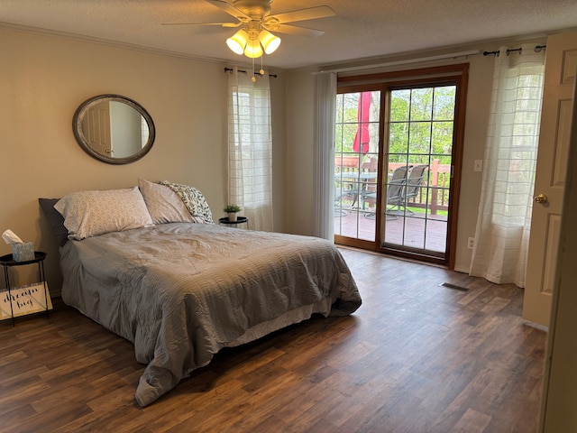 bedroom featuring access to exterior, dark wood-type flooring, ceiling fan, baseboards, and crown molding