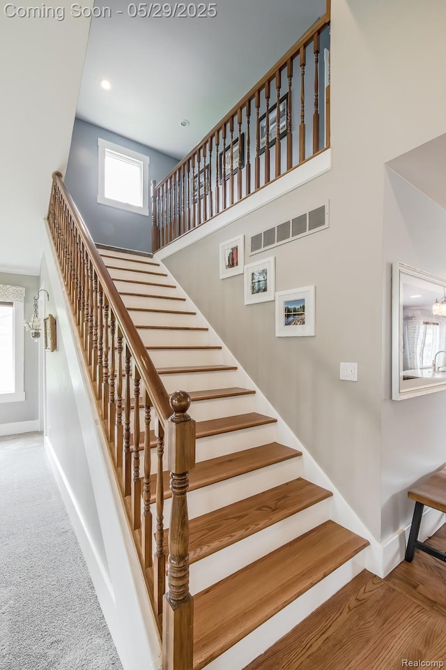 61 Cutting Dr, Troy, MI 48085 - stairs with baseboards, a towering ceiling, recessed lighting, and carpet