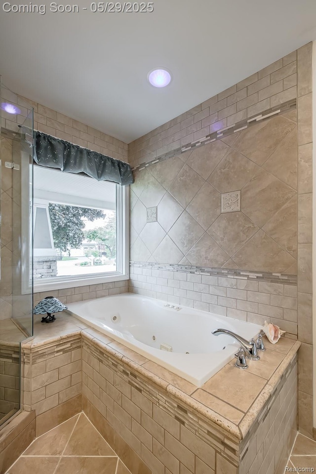 61 Cutting Dr, Troy, MI 48085 - bathroom featuring a whirlpool tub, tile patterned floors, and tile walls