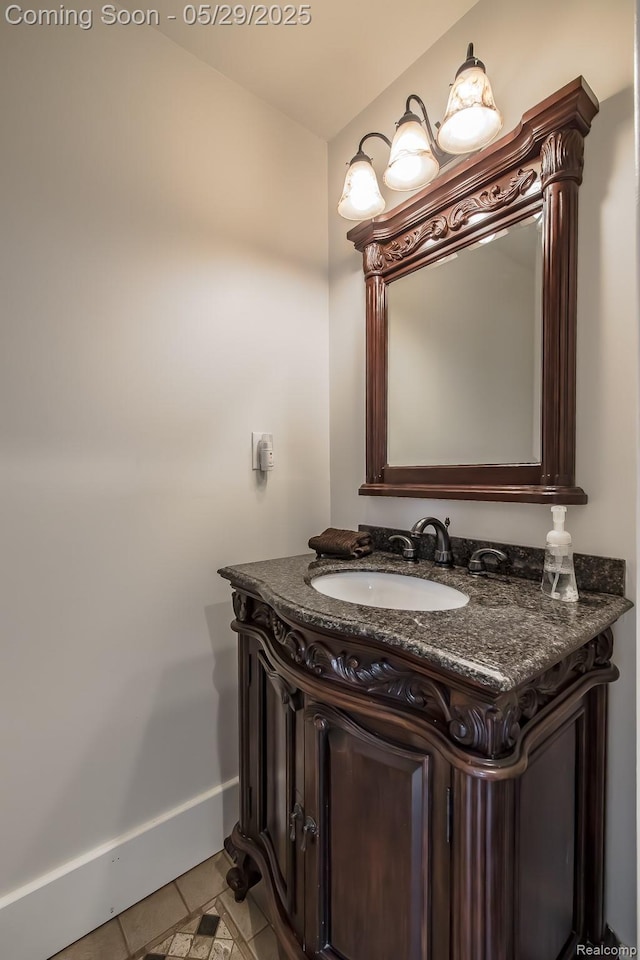 61 Cutting Dr, Troy, MI 48085 - bathroom featuring tile patterned flooring, vanity, and baseboards