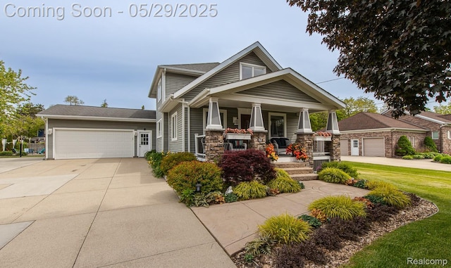 61 Cutting Dr, Troy, MI 48085 - craftsman-style house with covered porch, a garage, driveway, and stone siding