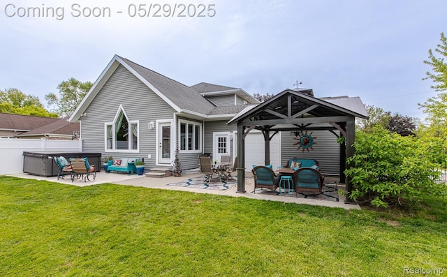 61 Cutting Dr, Troy, MI 48085 - back of property featuring entry steps, a patio area, a hot tub, and a shingled roof