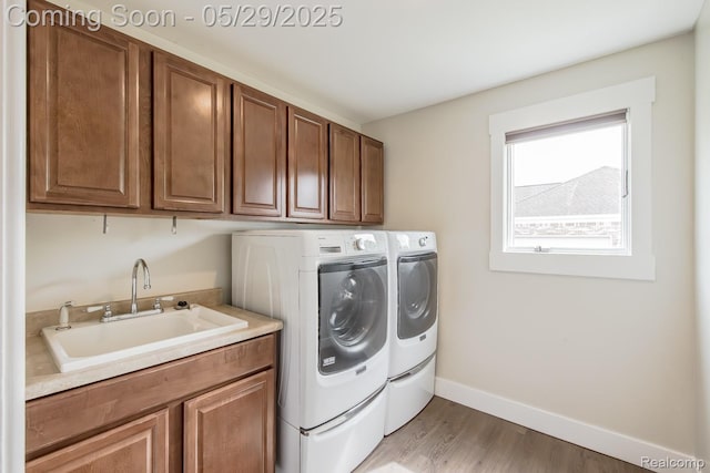 61 Cutting Dr, Troy, MI 48085 - washroom with independent washer and dryer, cabinet space, light wood-style floors, and baseboards