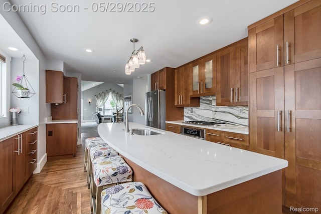 61 Cutting Dr, Troy, MI 48085 - kitchen with a sink, freestanding refrigerator, brown cabinetry, wall oven, and glass insert cabinets