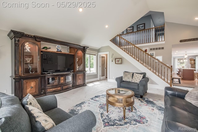 61 Cutting Dr, Troy, MI 48085 - living area featuring stairs, baseboards, recessed lighting, and high vaulted ceiling
