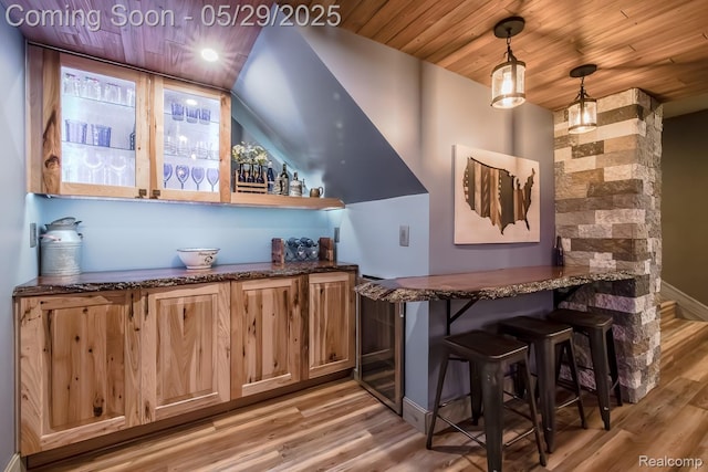 61 Cutting Dr, Troy, MI 48085 - indoor bar featuring light wood-style flooring, wood ceiling, and hanging light fixtures