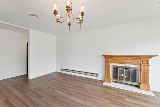 unfurnished living room with a chandelier, wood finished floors, visible vents, and a baseboard heating unit