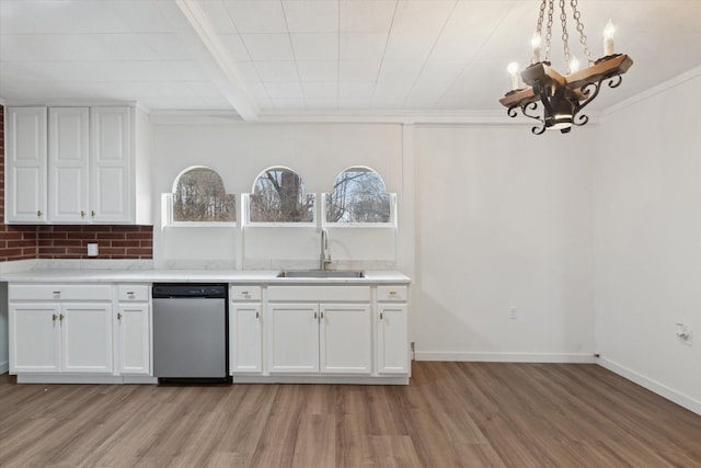 kitchen featuring a sink, stainless steel dishwasher, a notable chandelier, and light wood-style floors