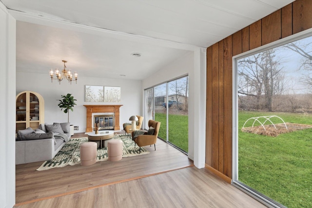 sunroom featuring an inviting chandelier