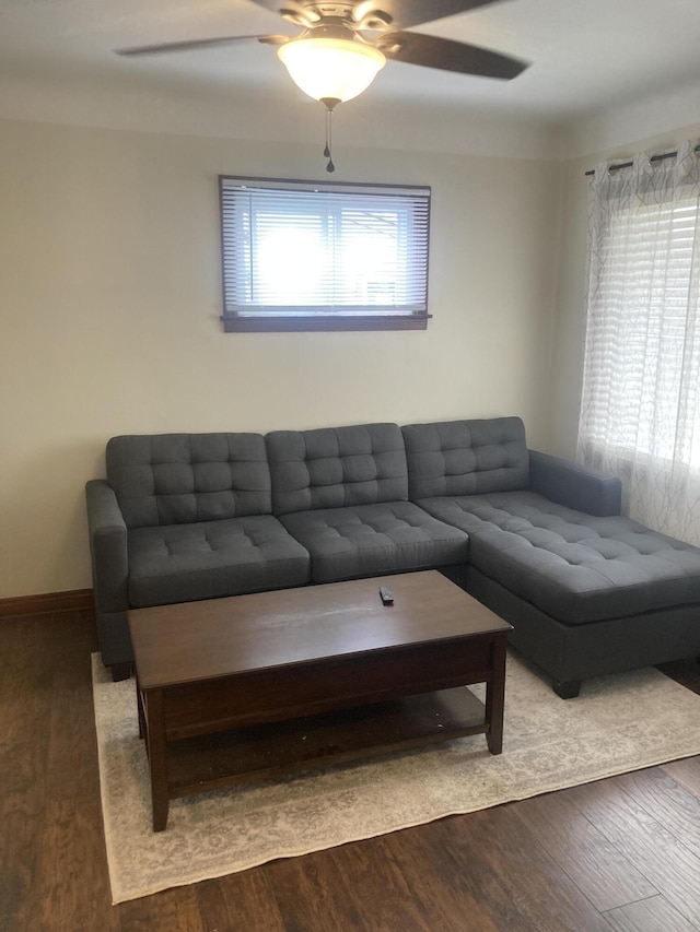 living area featuring ceiling fan and wood finished floors