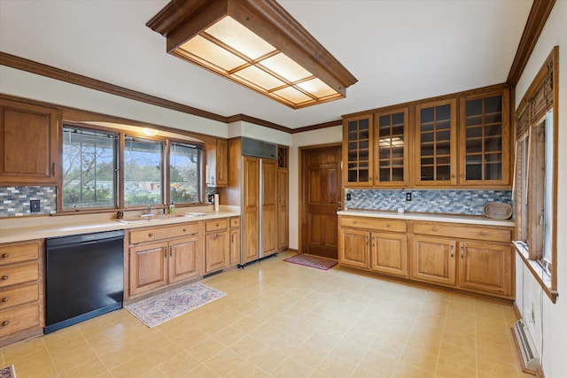 kitchen with light countertops, black dishwasher, tasteful backsplash, and a sink