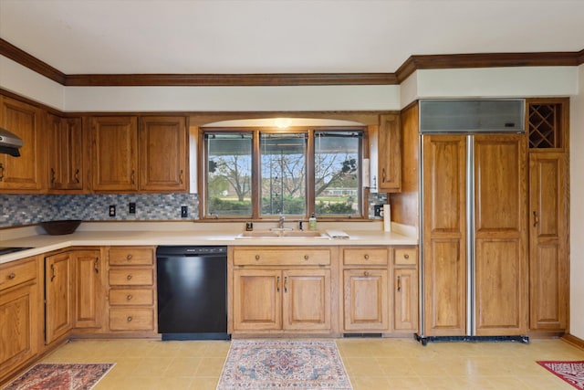 kitchen featuring a sink, brown cabinets, black appliances, backsplash, and light countertops
