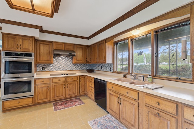 kitchen with black appliances, light countertops, a sink, and under cabinet range hood