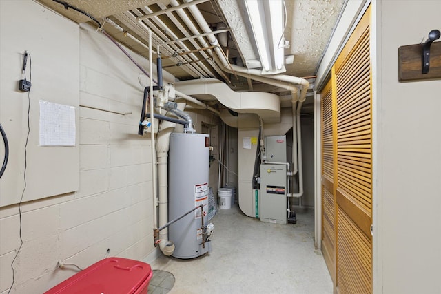 utility room featuring heating unit and water heater