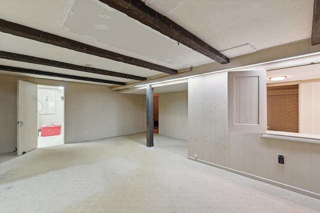 finished below grade area with wood walls and carpet flooring