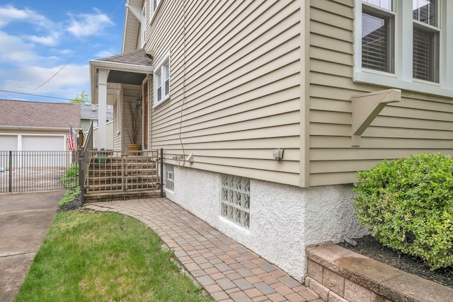 view of home's exterior with fence