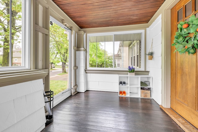 unfurnished sunroom with wooden ceiling and hardwood / wood-style flooring