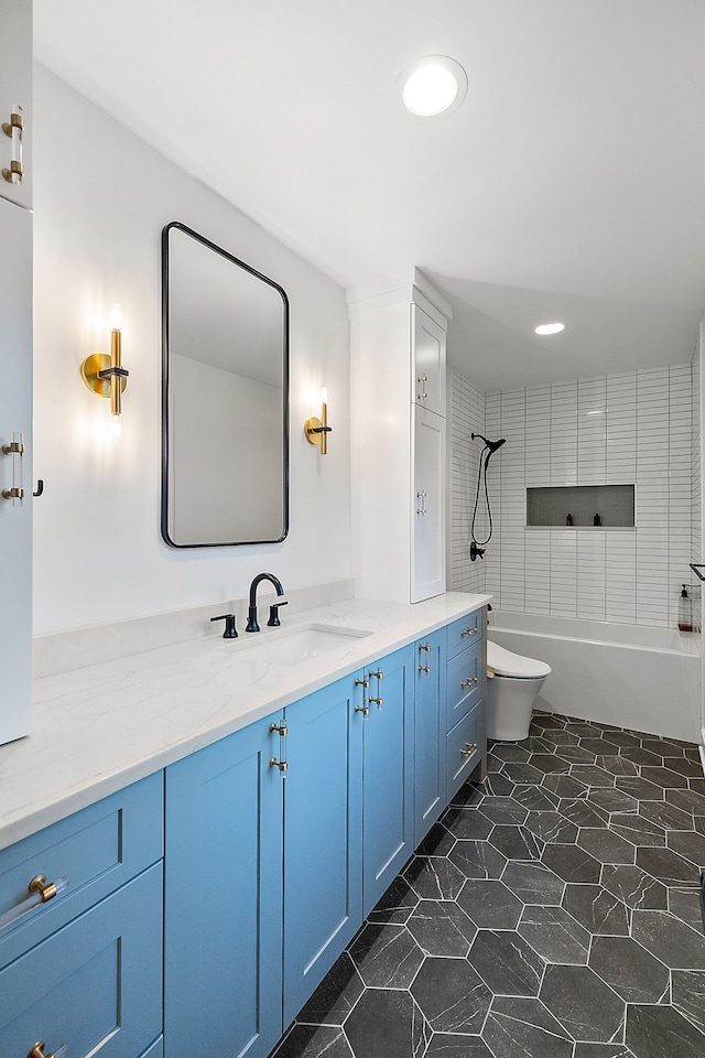 full bath with toilet, vanity, and recessed lighting
