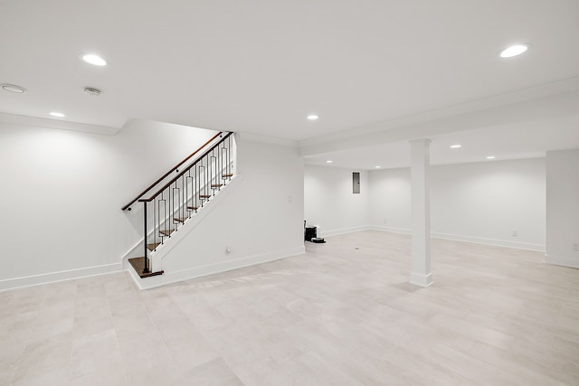 finished basement featuring stairs, baseboards, and recessed lighting