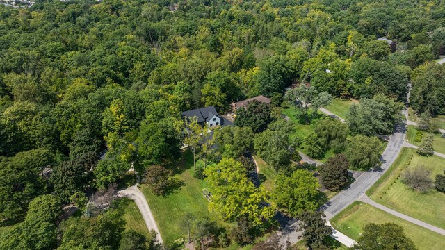 drone / aerial view featuring a view of trees