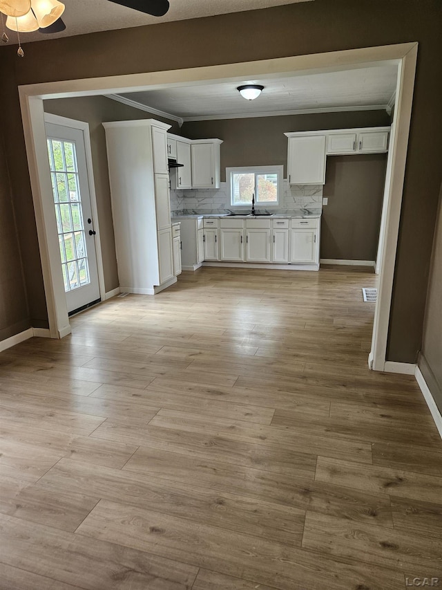 4084 Seneca St, Weston, MI 49289 - kitchen featuring white cabinetry, a wealth of natural light, and a sink