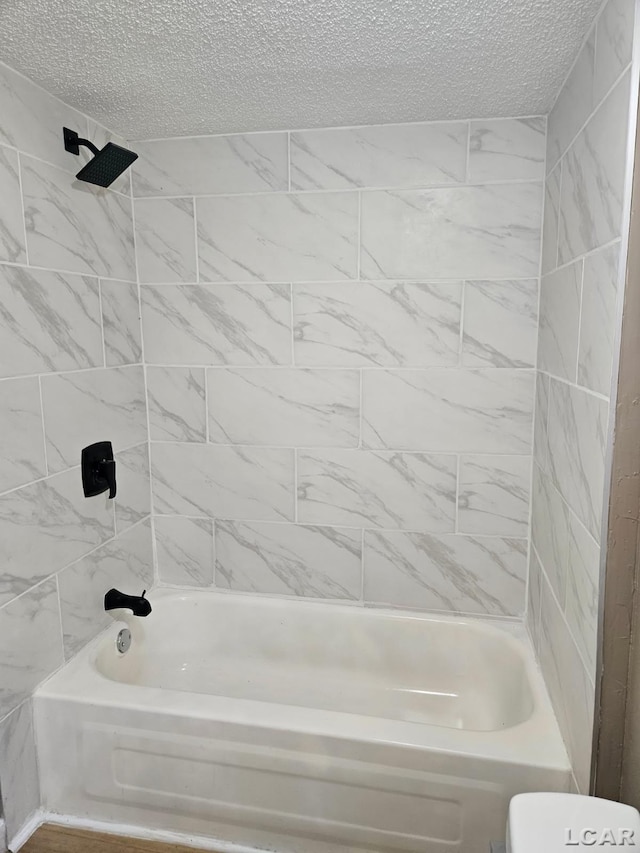 4084 Seneca St, Weston, MI 49289 - full bath featuring a textured ceiling, toilet, and washtub / shower combination