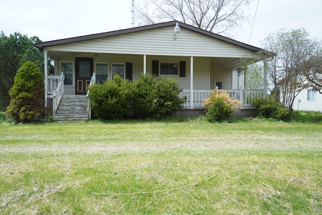 view of front facade featuring a porch and a front yard