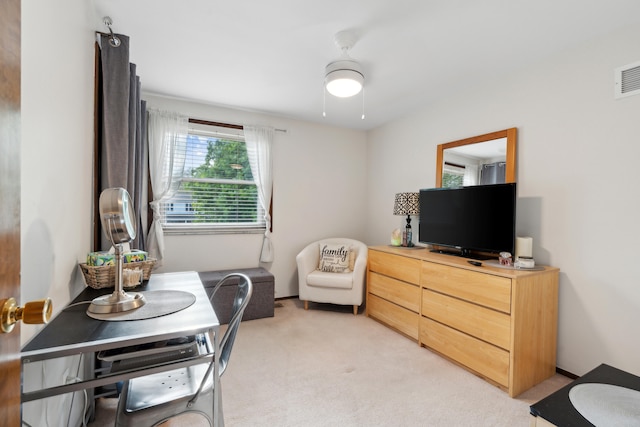 bedroom featuring light colored carpet and visible vents