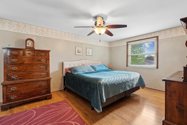 bedroom with light wood-style floors and ceiling fan
