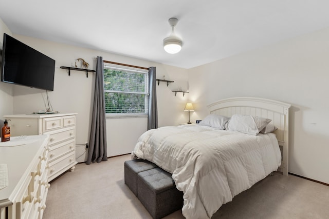 bedroom with light colored carpet