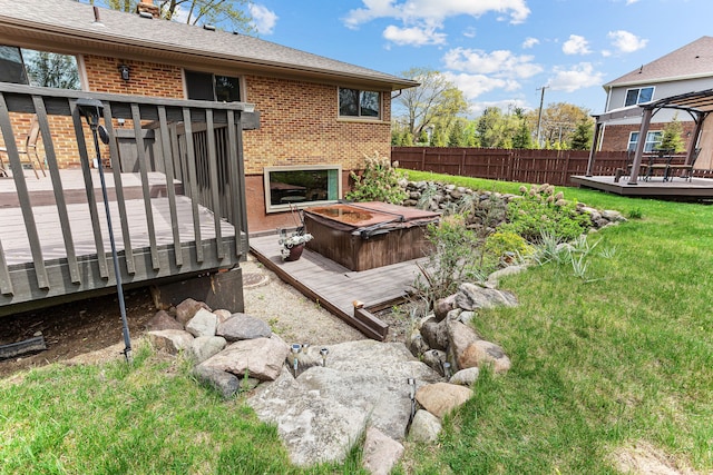 view of yard with fence and a wooden deck