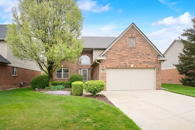 traditional-style home with brick siding, a front lawn, concrete driveway, and a garage