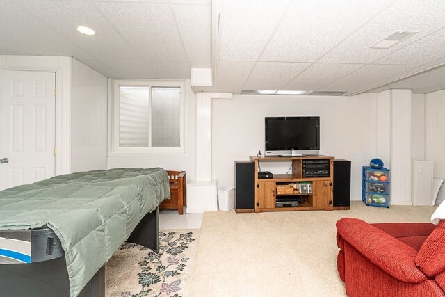 bedroom with carpet flooring, a drop ceiling, and recessed lighting