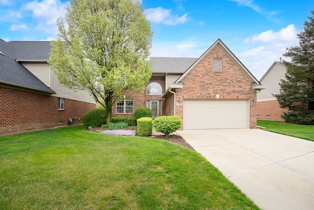traditional-style home featuring brick siding, a front lawn, driveway, and a garage