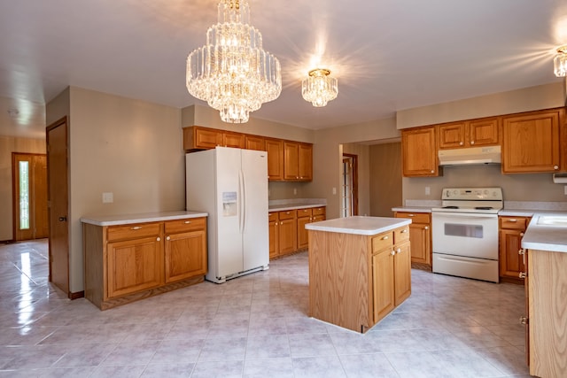 kitchen with white appliances, under cabinet range hood, light countertops, a center island, and a chandelier