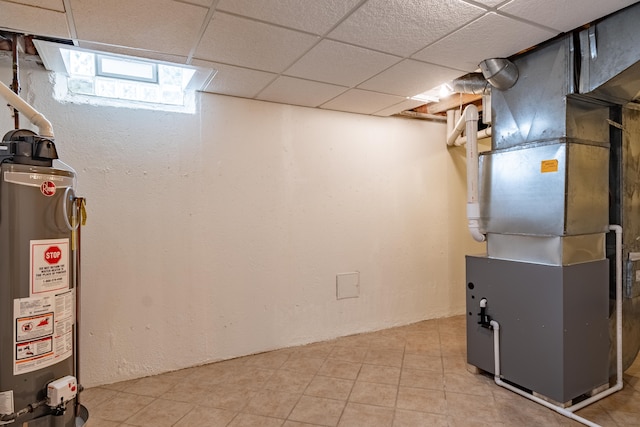 finished below grade area with gas water heater and light tile patterned floors