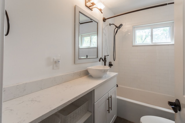 full bathroom with vanity, bathtub / shower combination, and toilet