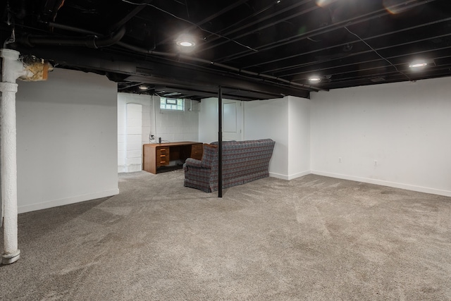 below grade area with carpet flooring and baseboards