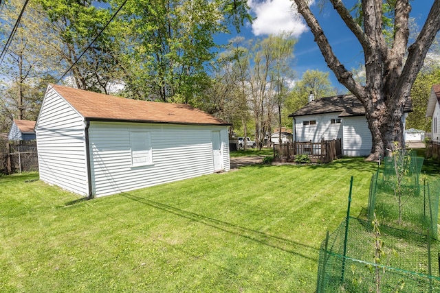 view of yard featuring an outbuilding and a wooden deck