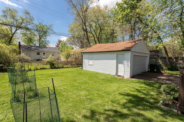 view of yard featuring an outbuilding and a garage