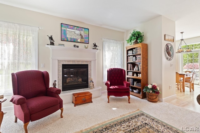 5225 Bent Oak Hwy, Adrian, MI 49221 - sitting room with baseboards, a tiled fireplace, and wood finished floors