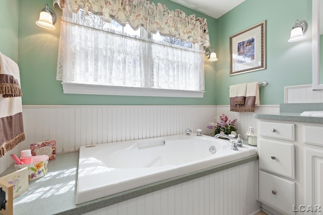 5225 Bent Oak Hwy, Adrian, MI 49221 - bathroom with vanity, wainscoting, and a bath