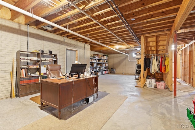 5225 Bent Oak Hwy, Adrian, MI 49221 - office with unfinished concrete floors and brick wall