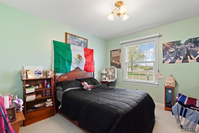 5225 Bent Oak Hwy, Adrian, MI 49221 - bedroom featuring baseboards, a notable chandelier, and carpet floors