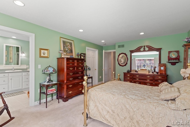 5225 Bent Oak Hwy, Adrian, MI 49221 - bedroom with a sink, ensuite bath, visible vents, recessed lighting, and light carpet