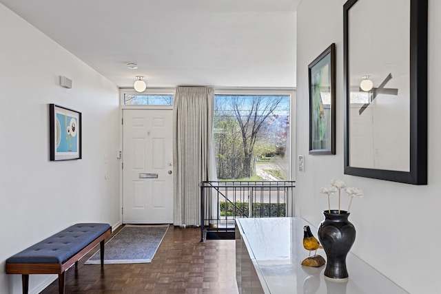 foyer entrance with baseboards
