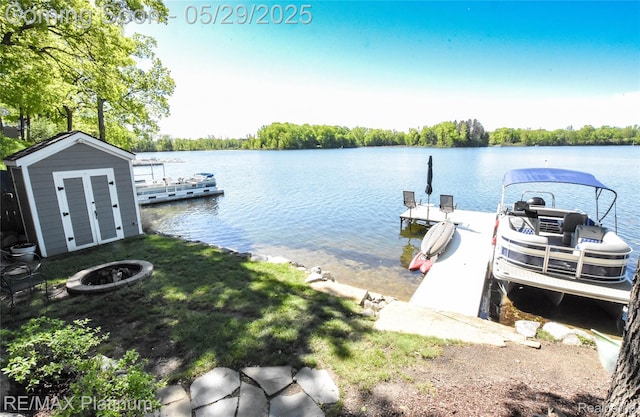 841 Hurley Dr, Howell, MI 48843 - dock area featuring an outdoor fire pit and a water view