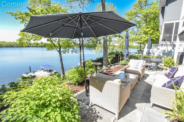 841 Hurley Dr, Howell, MI 48843 - view of patio with outdoor lounge area and a water view