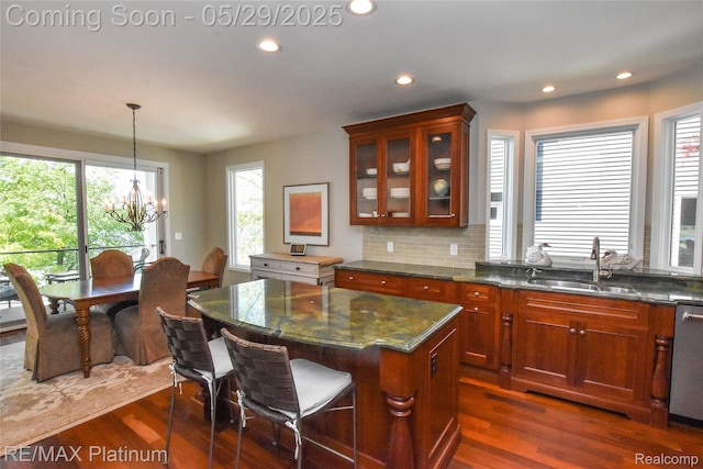 841 Hurley Dr, Howell, MI 48843 - kitchen featuring a sink, a chandelier, dark wood-type flooring, glass insert cabinets, and recessed lighting