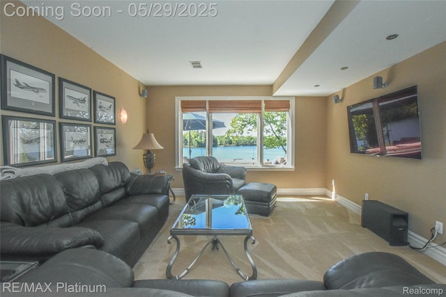 841 Hurley Dr, Howell, MI 48843 - carpeted living area featuring baseboards